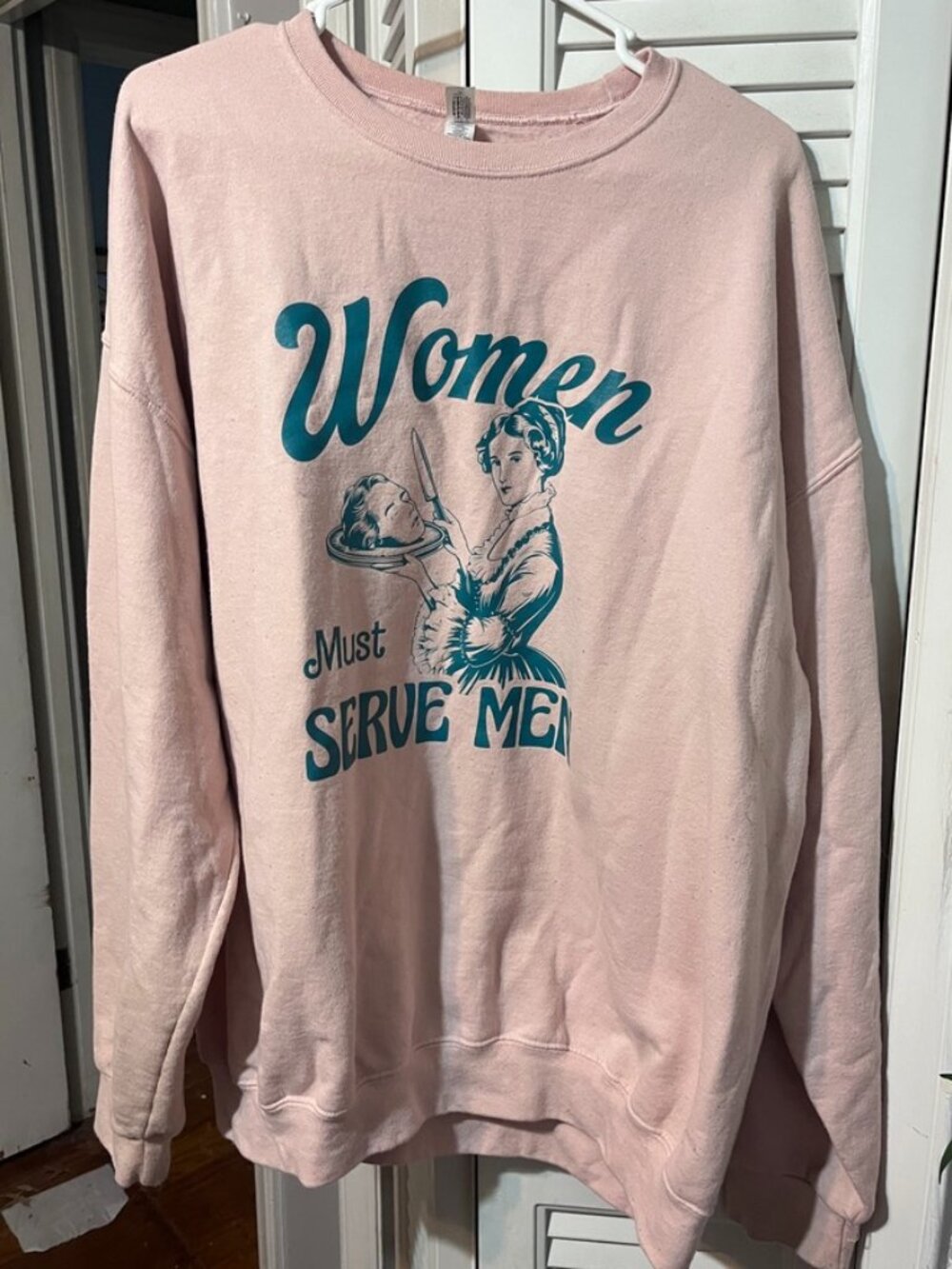 Light pink/peach "Women Should Serve Men" sweatshirt